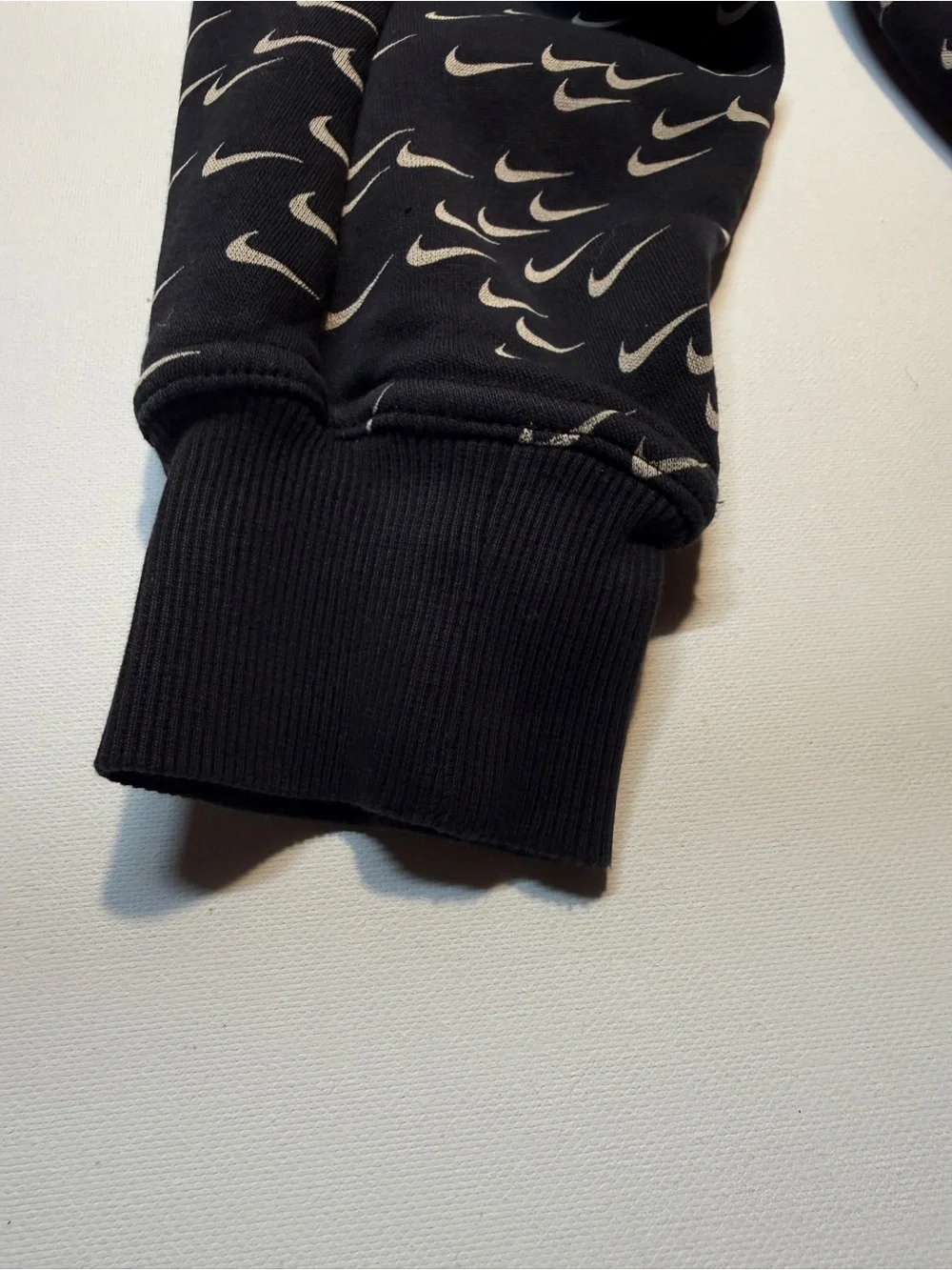 Nike‎ Black Hoodie with Repeating White Swoosh Print